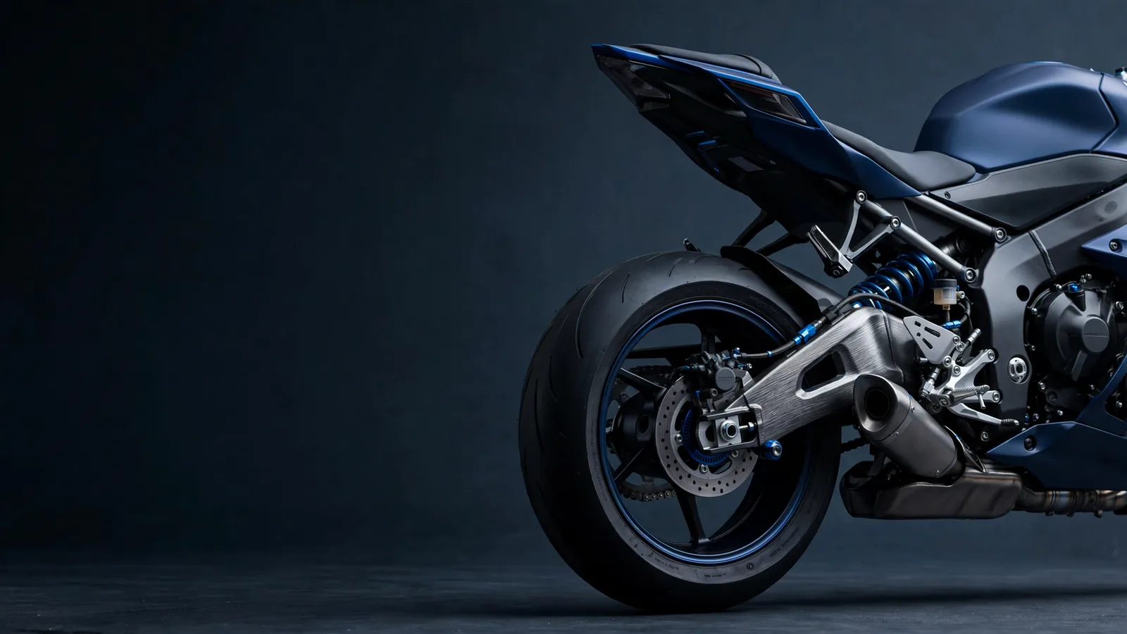 Motorcycle components in a cool metal and blue composition